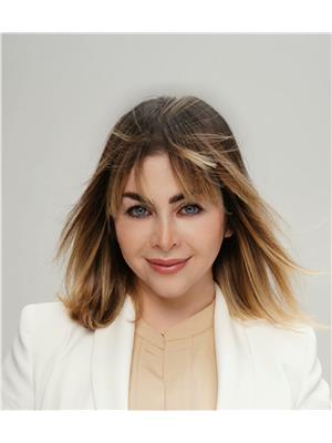NELL HAJIHA