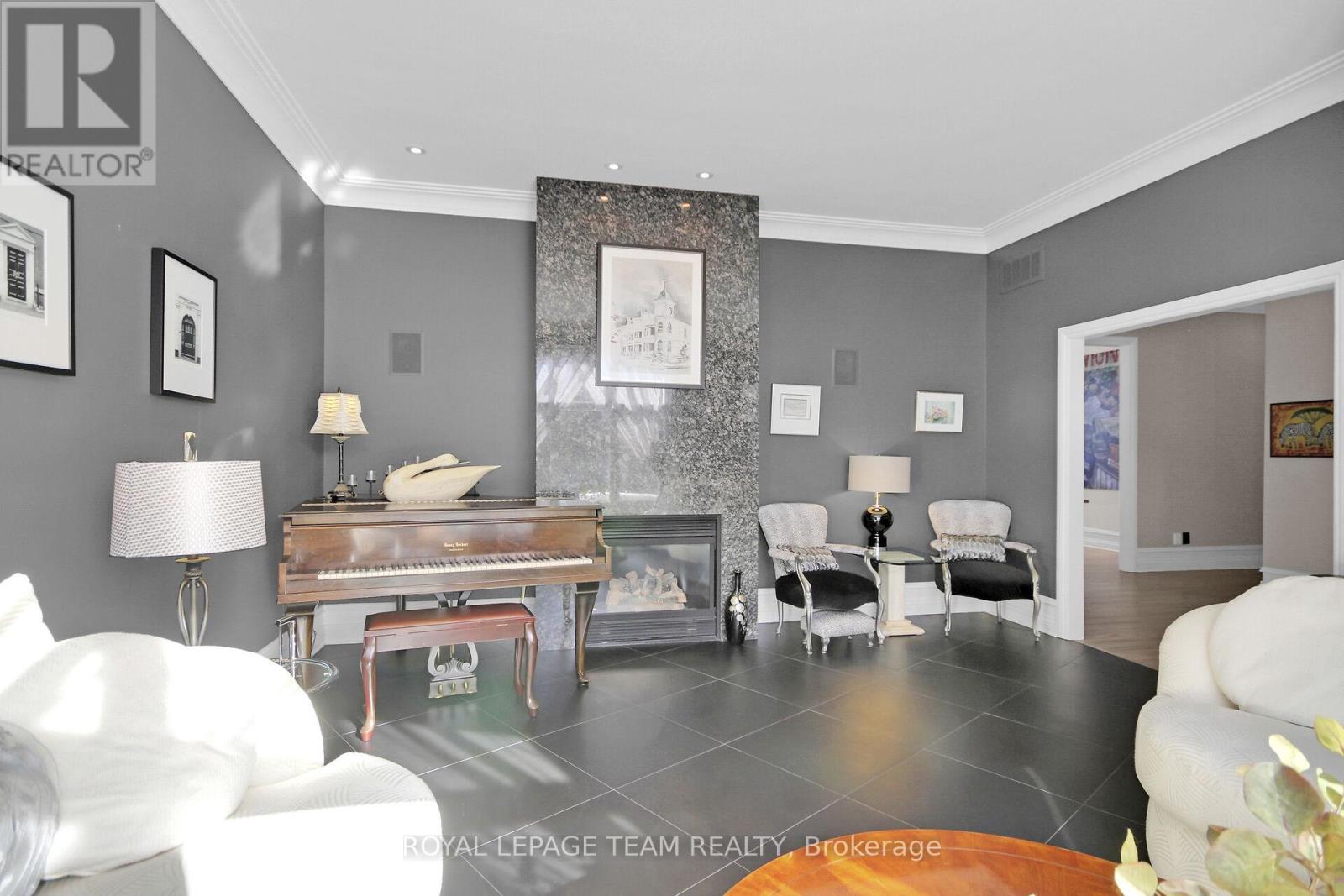 Formal Livingroom with Granite Faced Gas Fireplace