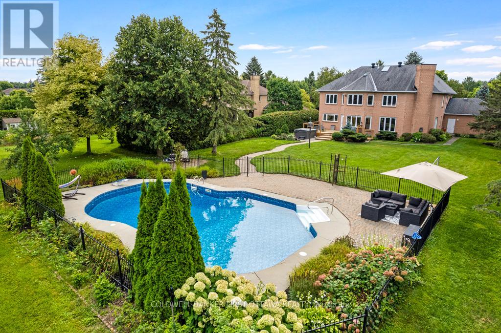 Lovely landscaped 0.7 acre; inground heated pool