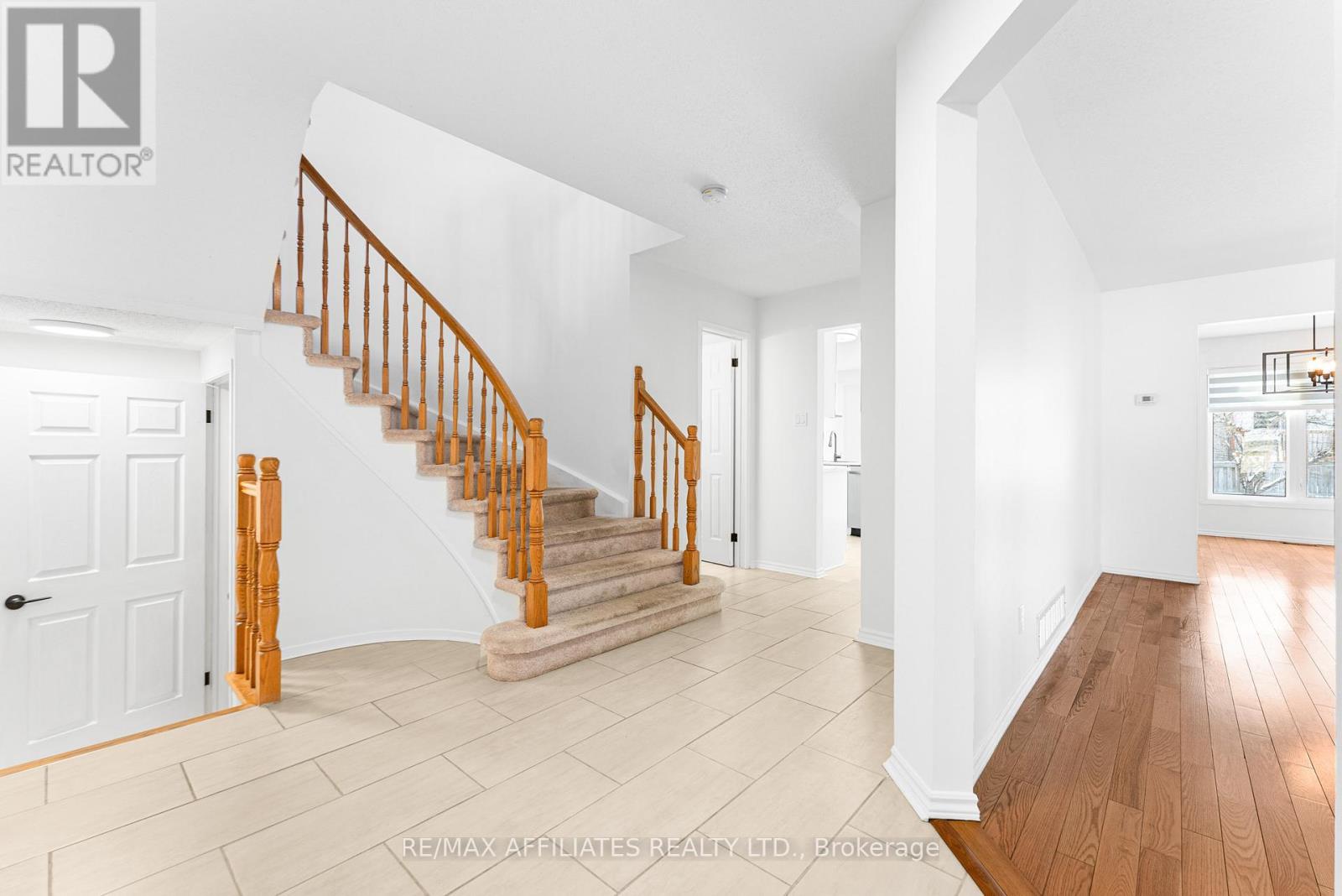 Hardwood + Tile Throughout Main Level