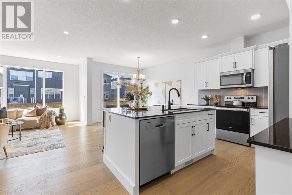 Single Family House for Sale in  belmont Villas SW Belmont Calgary 