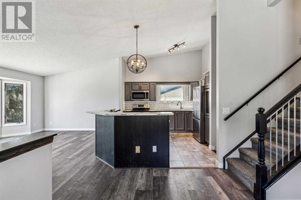 Single Family House 4 Level for Sale in  Hawkley Valley Road NW Hawkwood Calgary 