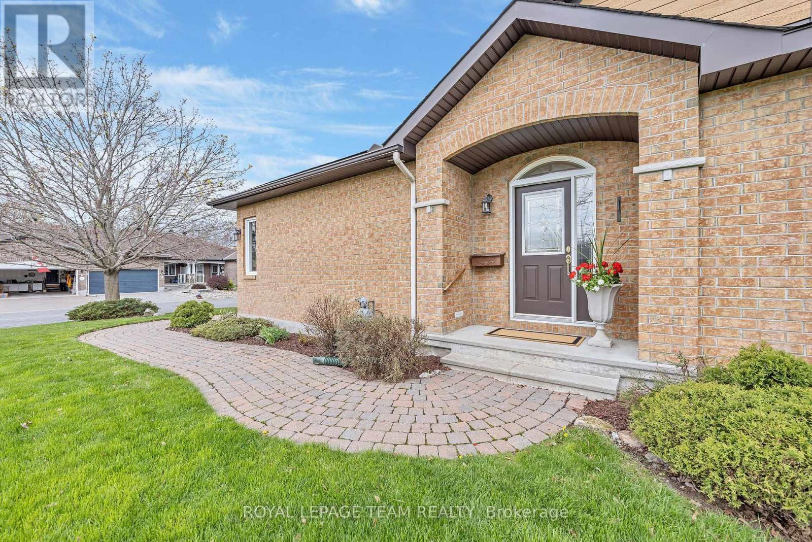 Brick semi bungalow, end unit on oversized lot