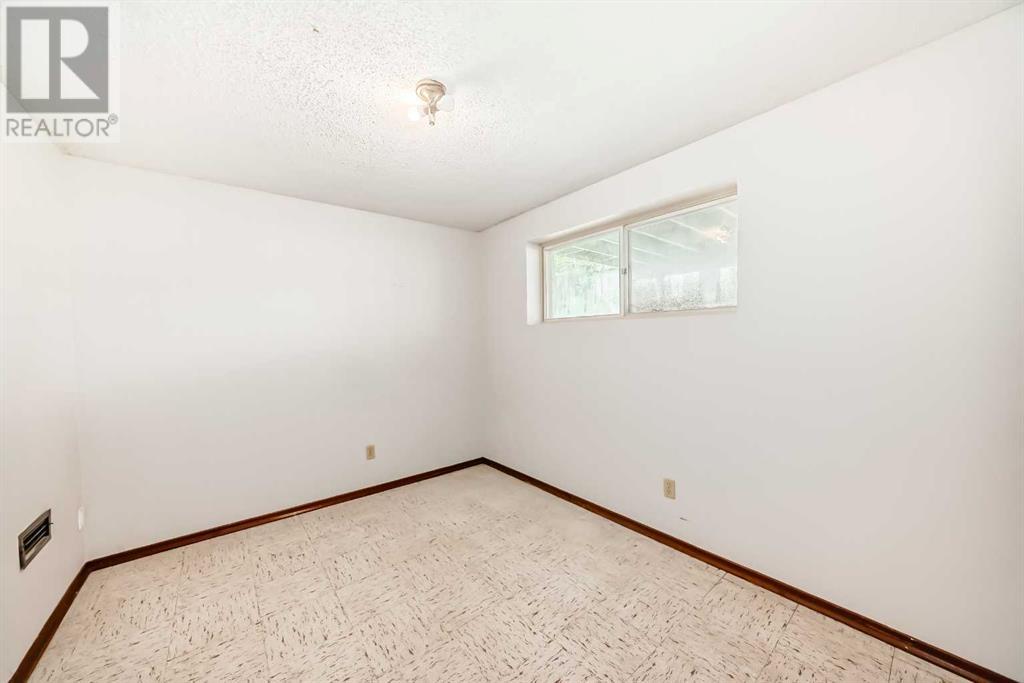 Single Family House Bi-level for Sale in  Barron Drive NW Brentwood Calgary 