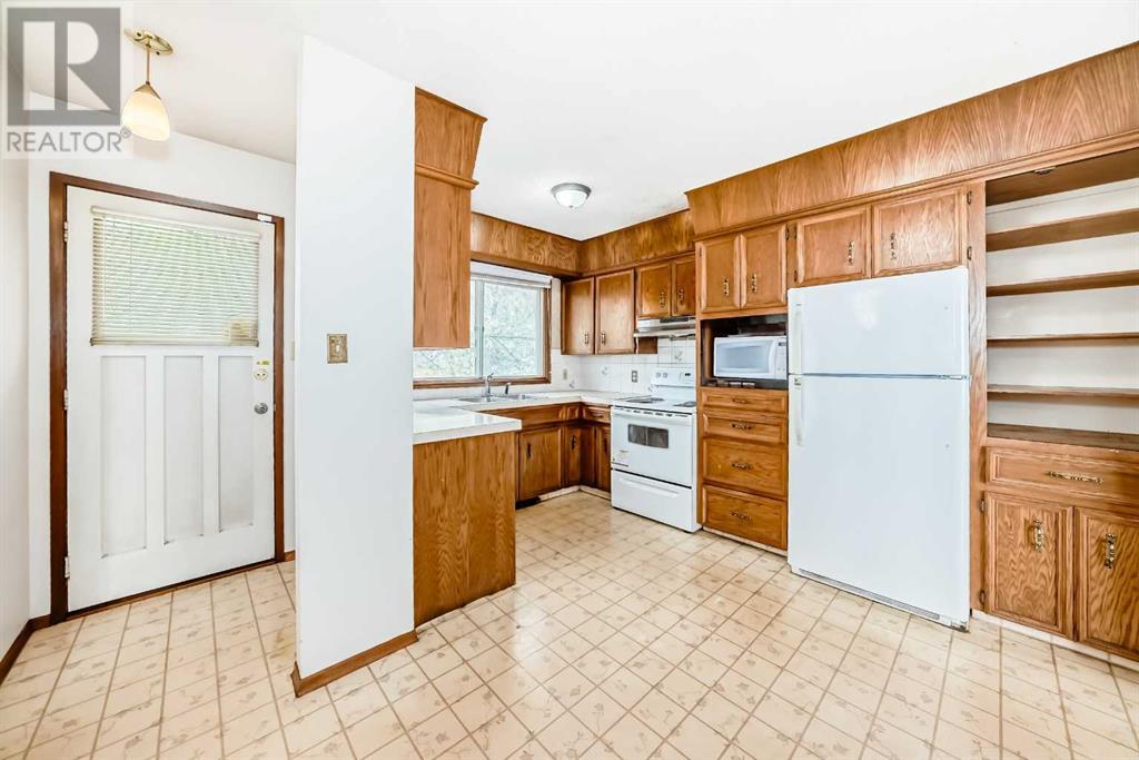Single Family House Bi-level for Sale in  Barron Drive NW Brentwood Calgary 
