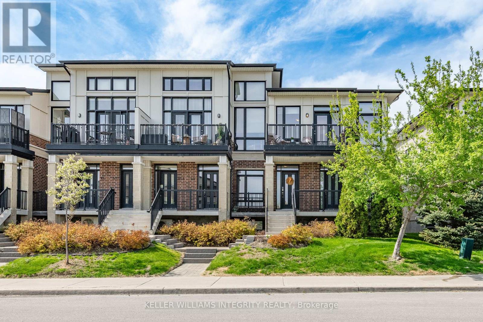 Modern 2-bedroom upper-level stacked condo.