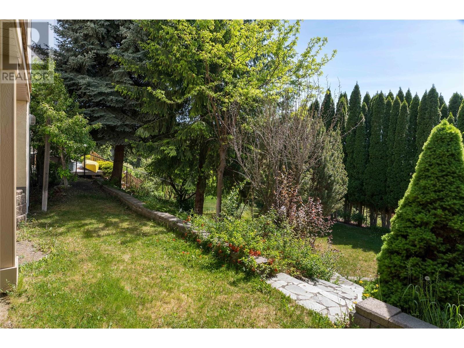 Photo 4 of 740 Royal Pine Drive, Kelowna BC