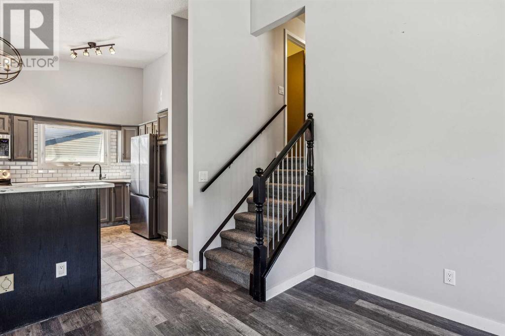 Single Family House 4 Level for Sale in  Hawkley Valley Road NW Hawkwood Calgary 