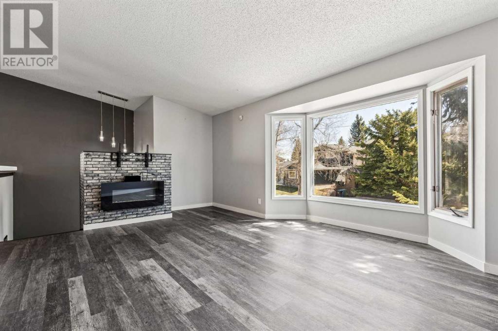 Single Family House 4 Level for Sale in  Hawkley Valley Road NW Hawkwood Calgary 