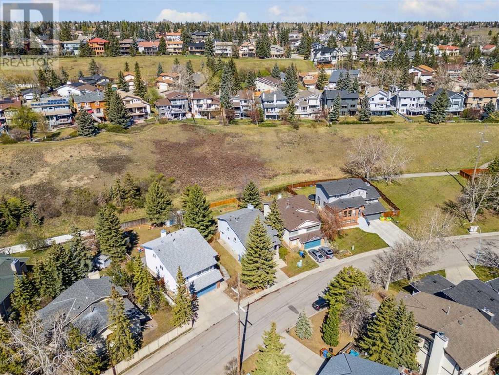 Single Family House 4 Level for Sale in  Hawkley Valley Road NW Hawkwood Calgary 