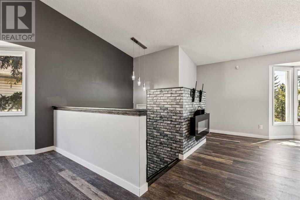 Single Family House 4 Level for Sale in  Hawkley Valley Road NW Hawkwood Calgary 
