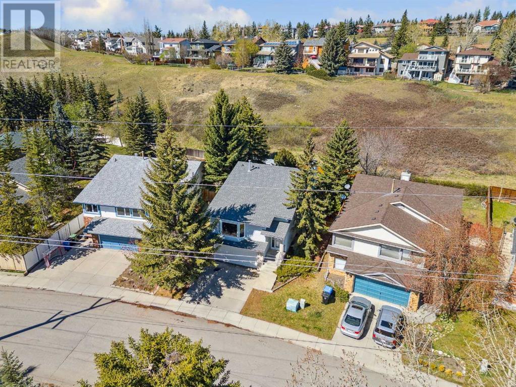 Single Family House 4 Level for Sale in  Hawkley Valley Road NW Hawkwood Calgary 
