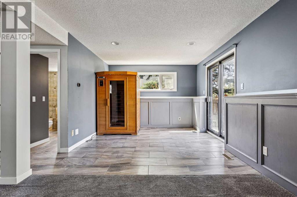 Single Family House 4 Level for Sale in  Hawkley Valley Road NW Hawkwood Calgary 