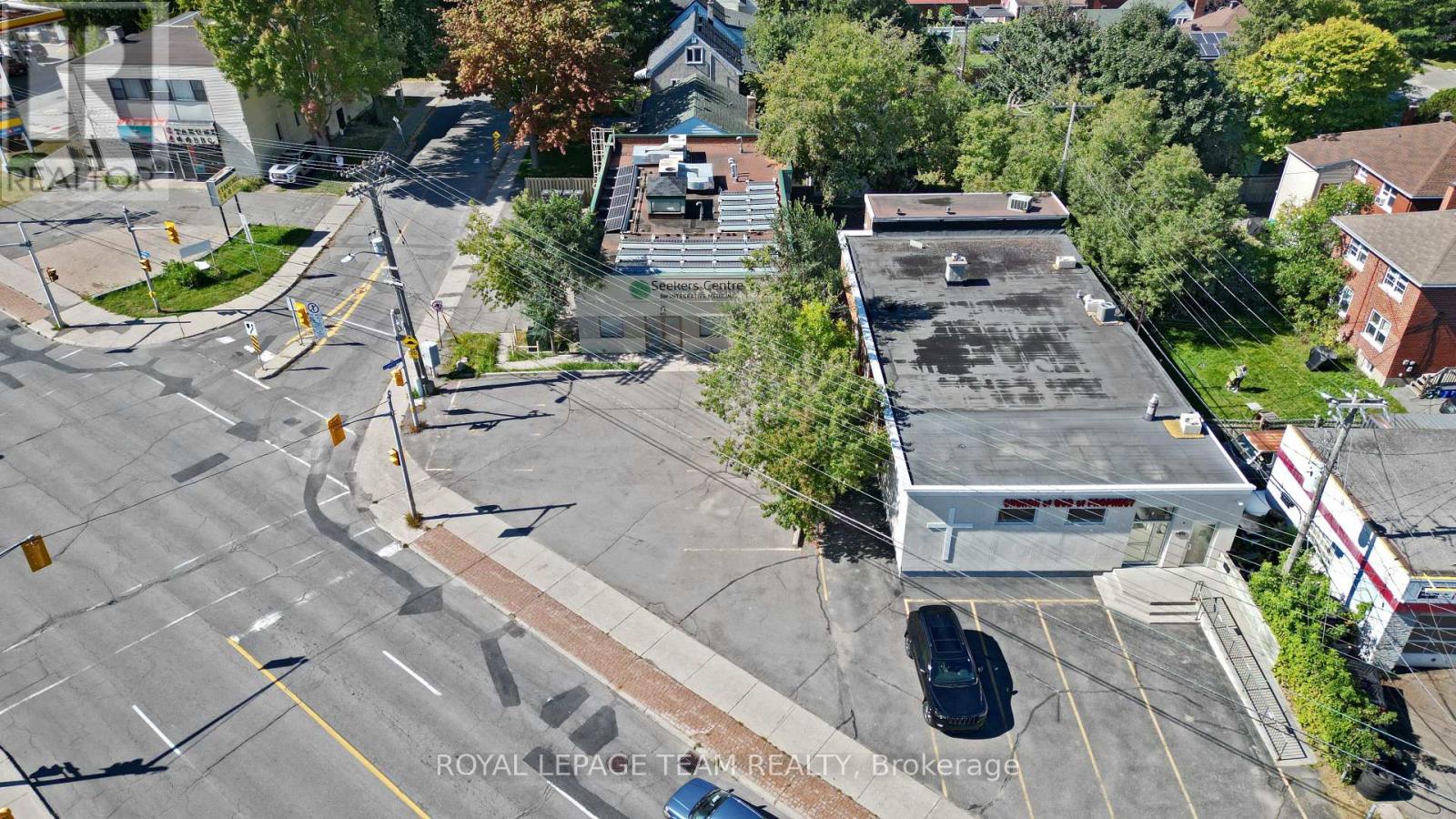 Aerial image of site and building