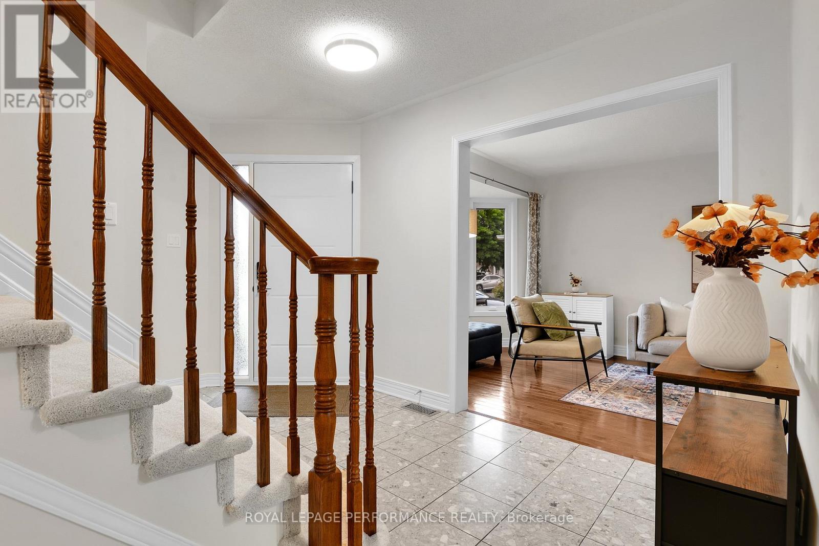 Grand foyer opens to living room