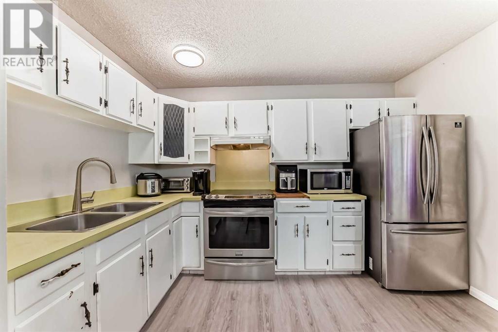Single Family House Bi-level for Sale in  Canfield Crescent SW Canyon Meadows Calgary 
