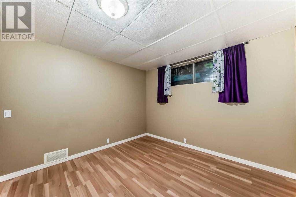 Single Family House Bi-level for Sale in  Canfield Crescent SW Canyon Meadows Calgary 