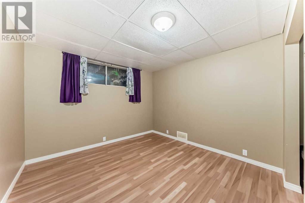 Single Family House Bi-level for Sale in  Canfield Crescent SW Canyon Meadows Calgary 