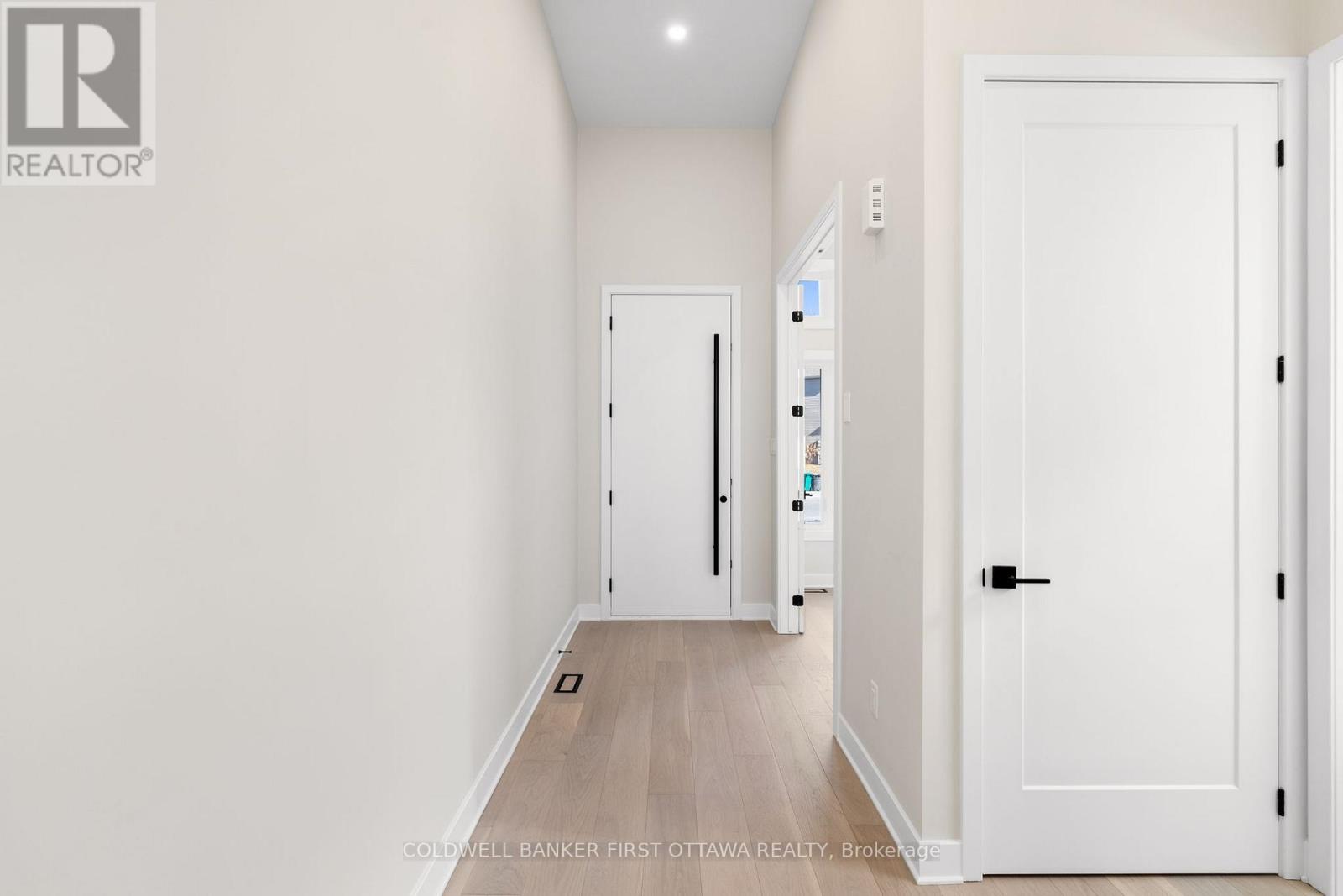 Front foyer w/ high Ceilings & white oak flooring.