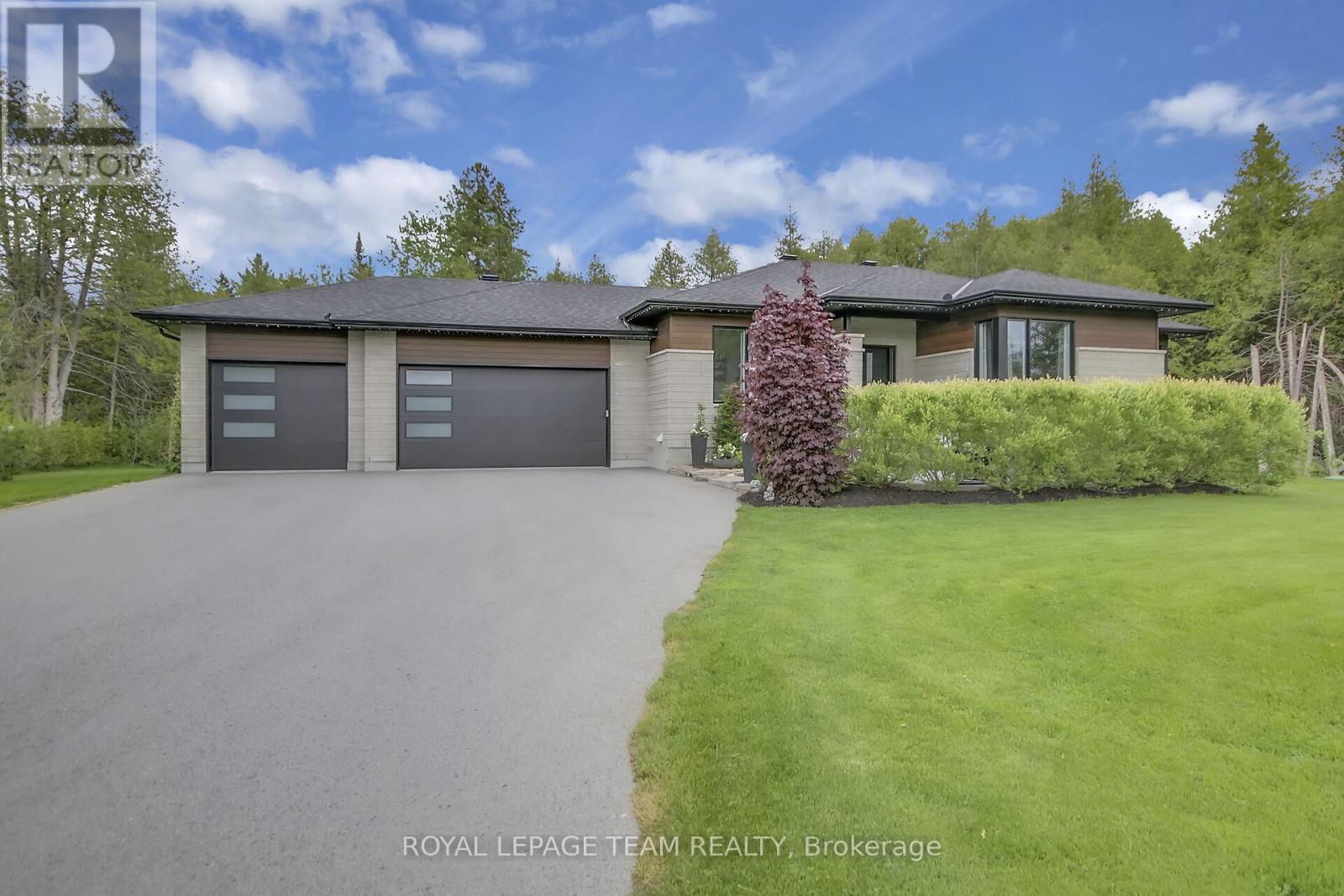 Oversized 3 car garage for your vehicles and toys!