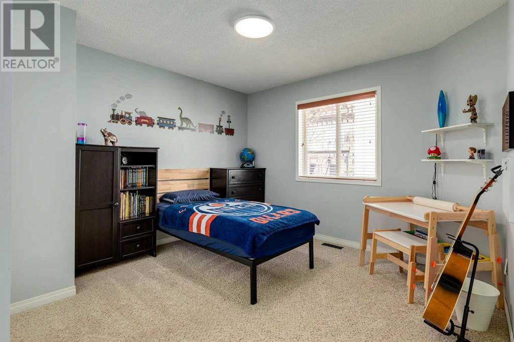 Single Family House Bi-level for Sale in  Alcock Close Rosemont Okotoks 