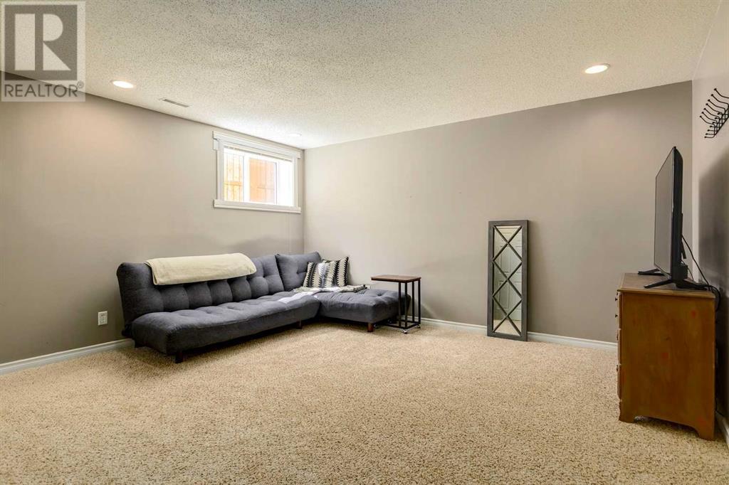 Single Family House Bi-level for Sale in  Alcock Close Rosemont Okotoks 