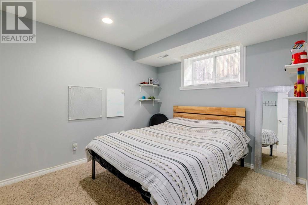 Single Family House Bi-level for Sale in  Alcock Close Rosemont Okotoks 
