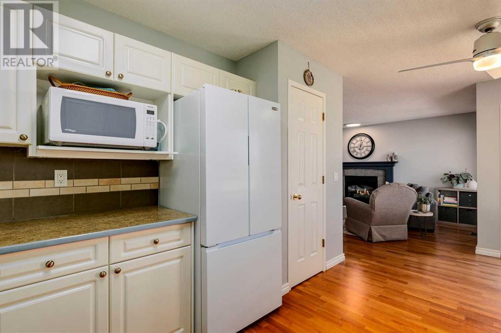 Single Family House Bi-level for Sale in  Alcock Close Rosemont Okotoks 