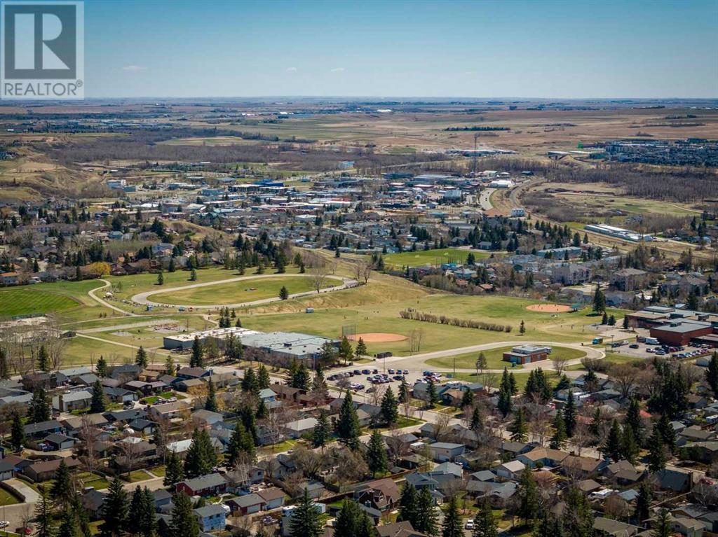 Single Family House Bi-level for Sale in  Alcock Close Rosemont Okotoks 