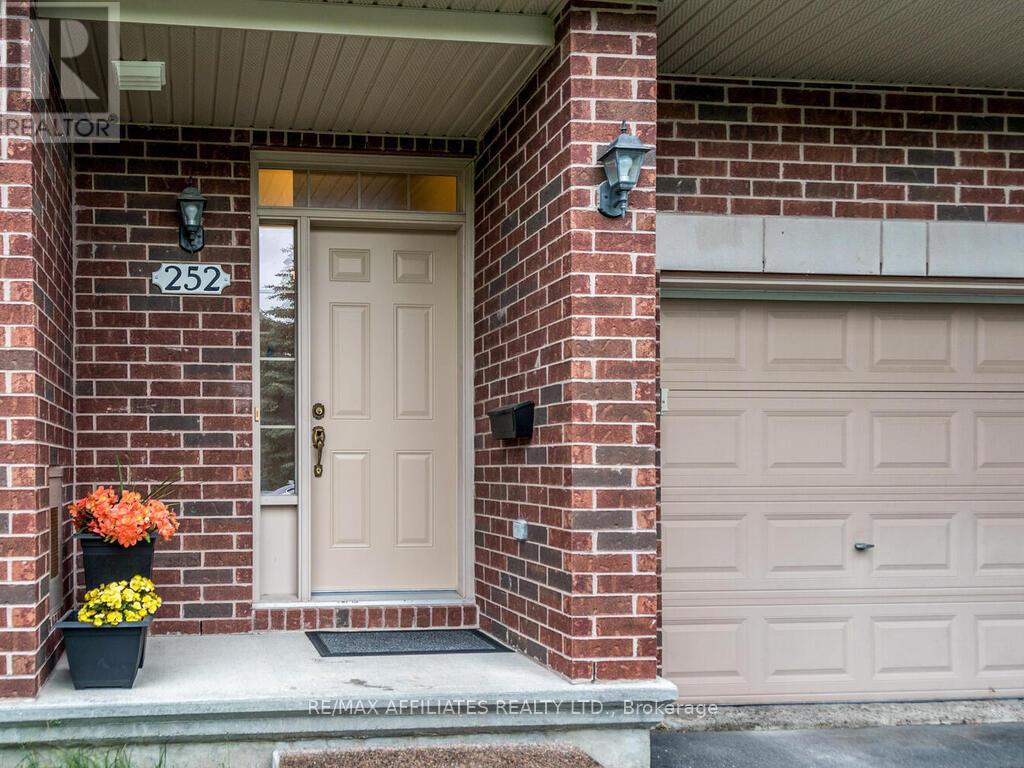 Private front entrance with attractive brick!