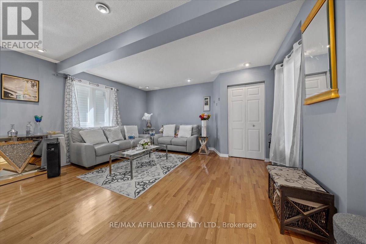 Spacious main floor living room with large windows