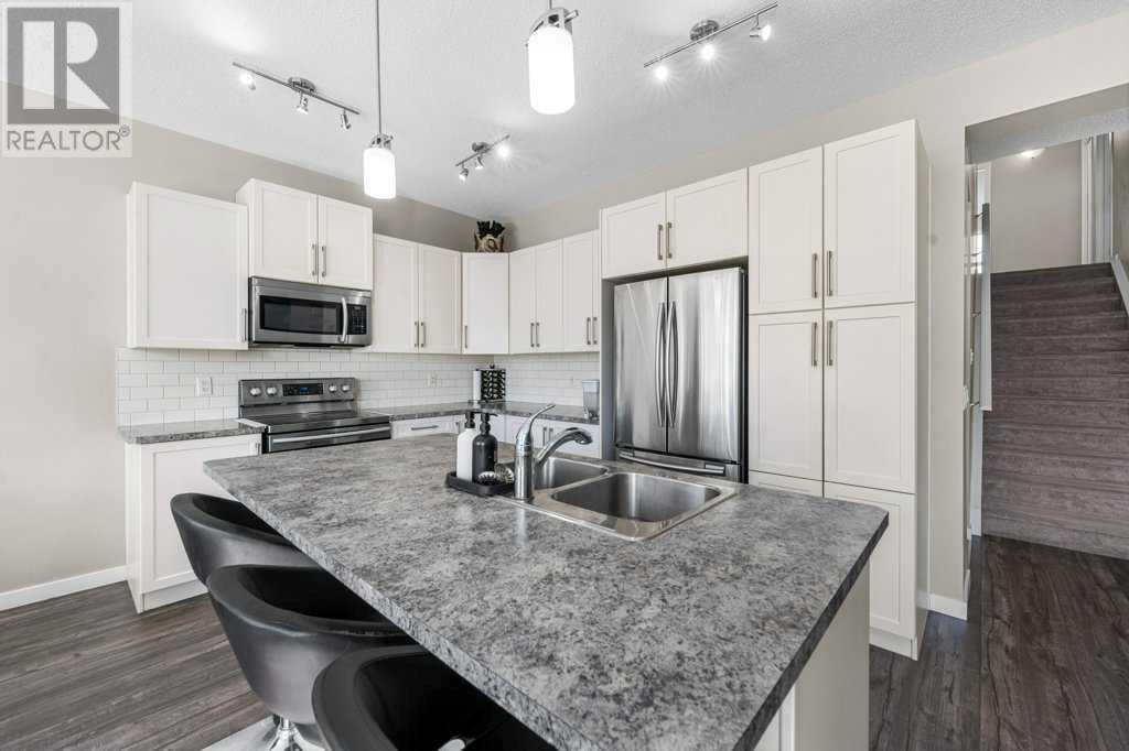 Single Family House 4 Level for Sale in  Howse Manor NE Livingston Calgary 