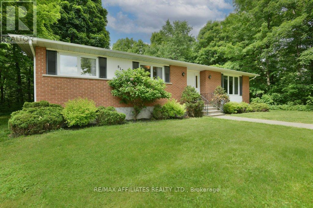 Detached 2 car garage with paved drive.