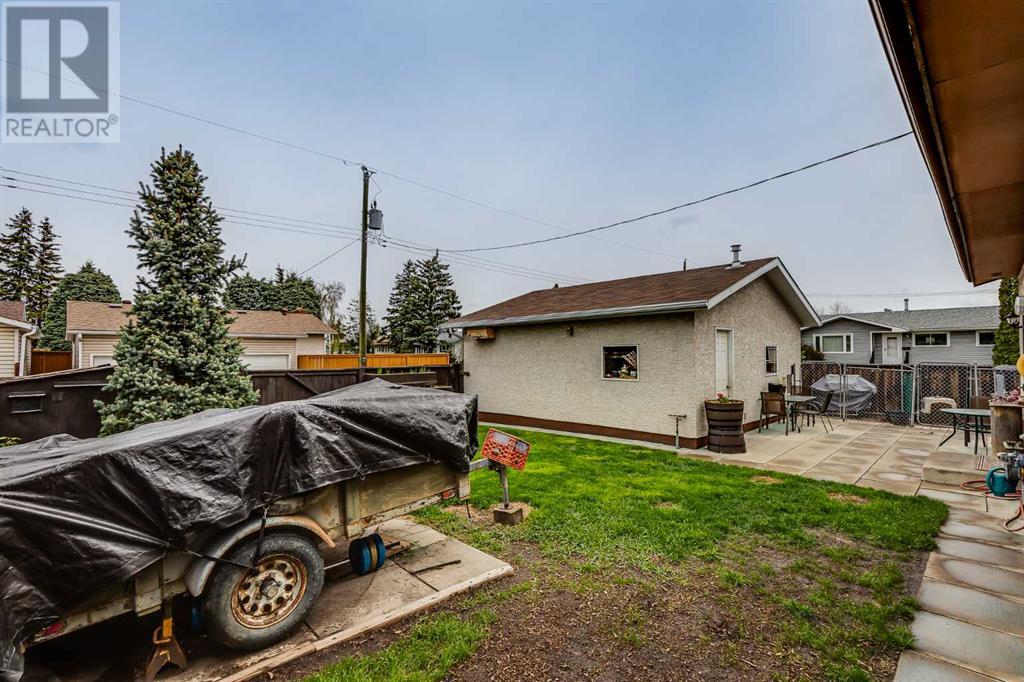 Single Family House Bungalow for Sale in  Manora Rise NE Marlborough Park Calgary 
