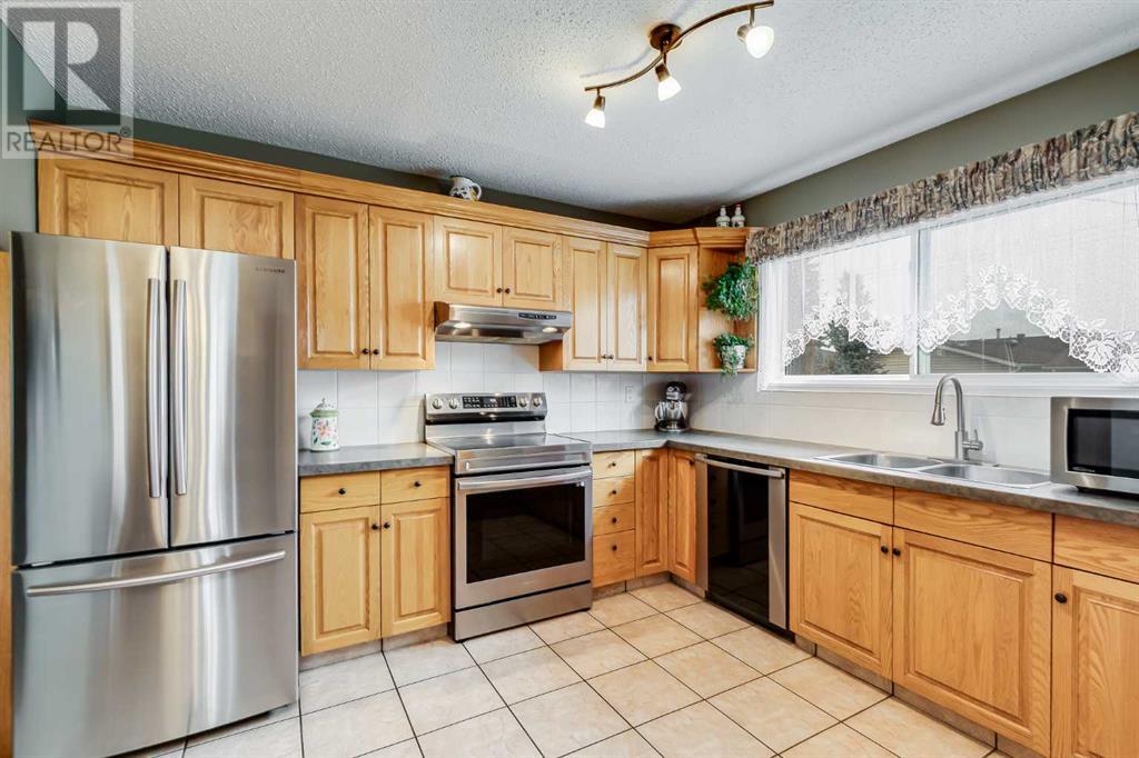 Single Family House Bungalow for Sale in  Manora Rise NE Marlborough Park Calgary 