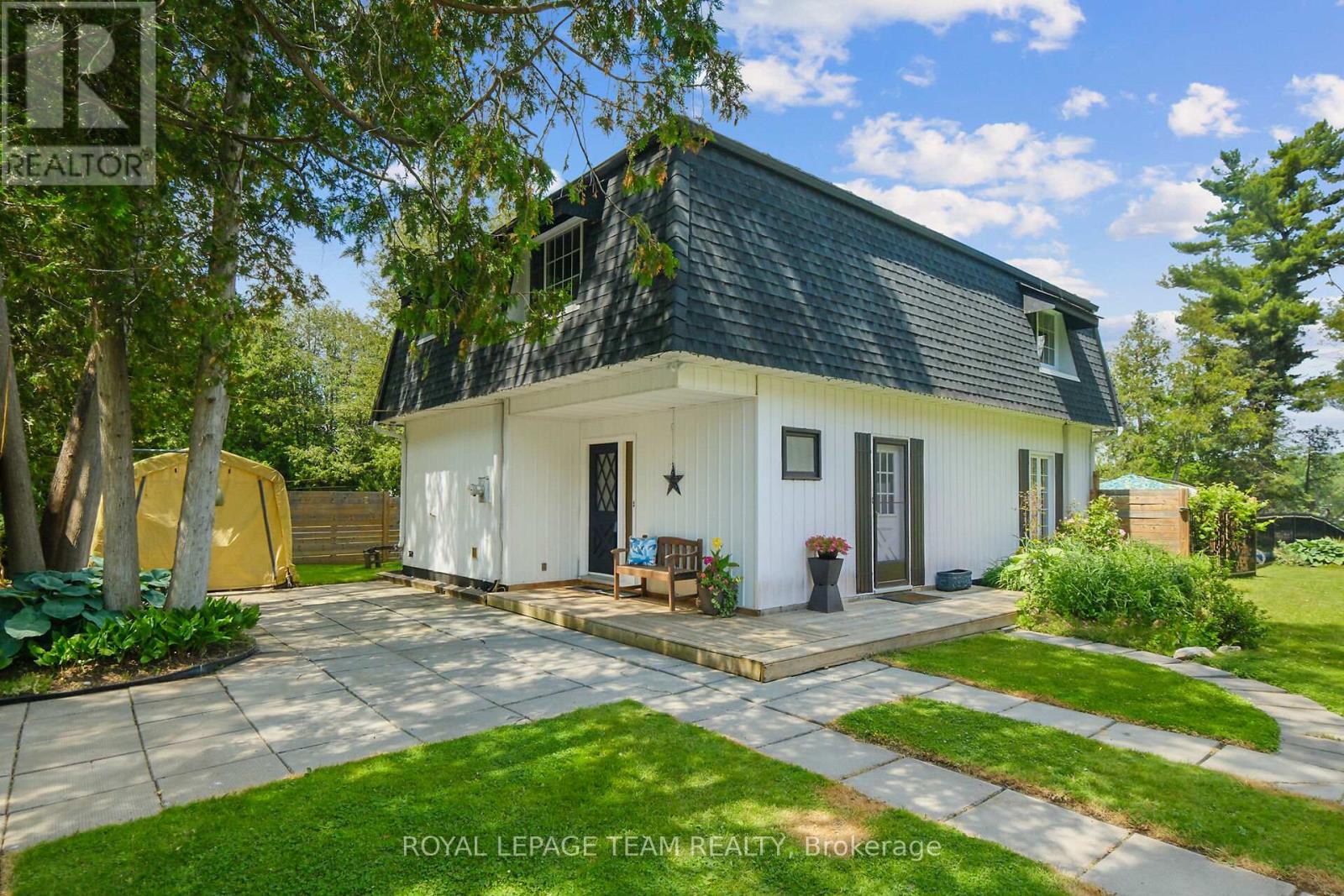 Mansard roof with metal board batton siding
