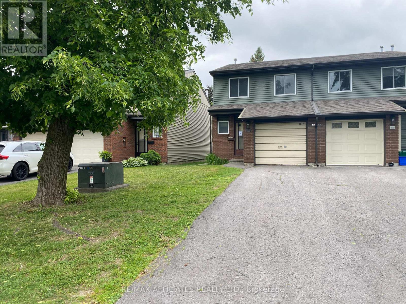 Large driveway and garage inside entry