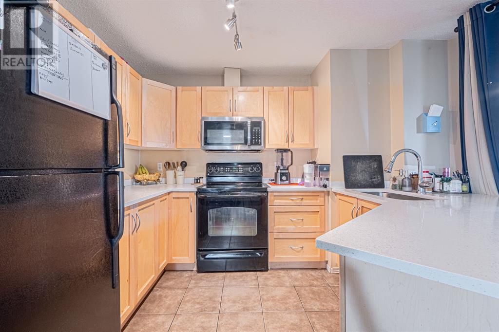 Photo 11 of 7105 304 Mackenzie Way Sw, Airdrie AB