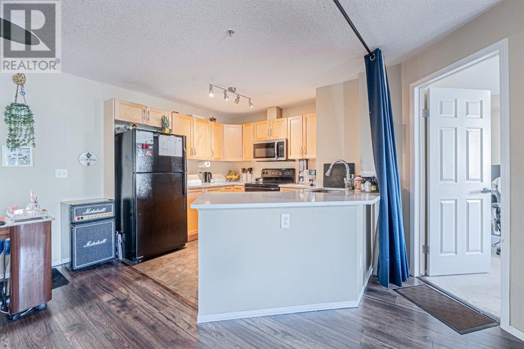 Photo 30 of 7105 304 Mackenzie Way Sw, Airdrie AB