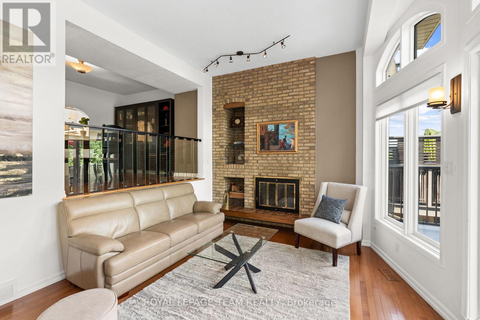 Living Room with Brick Fireplace