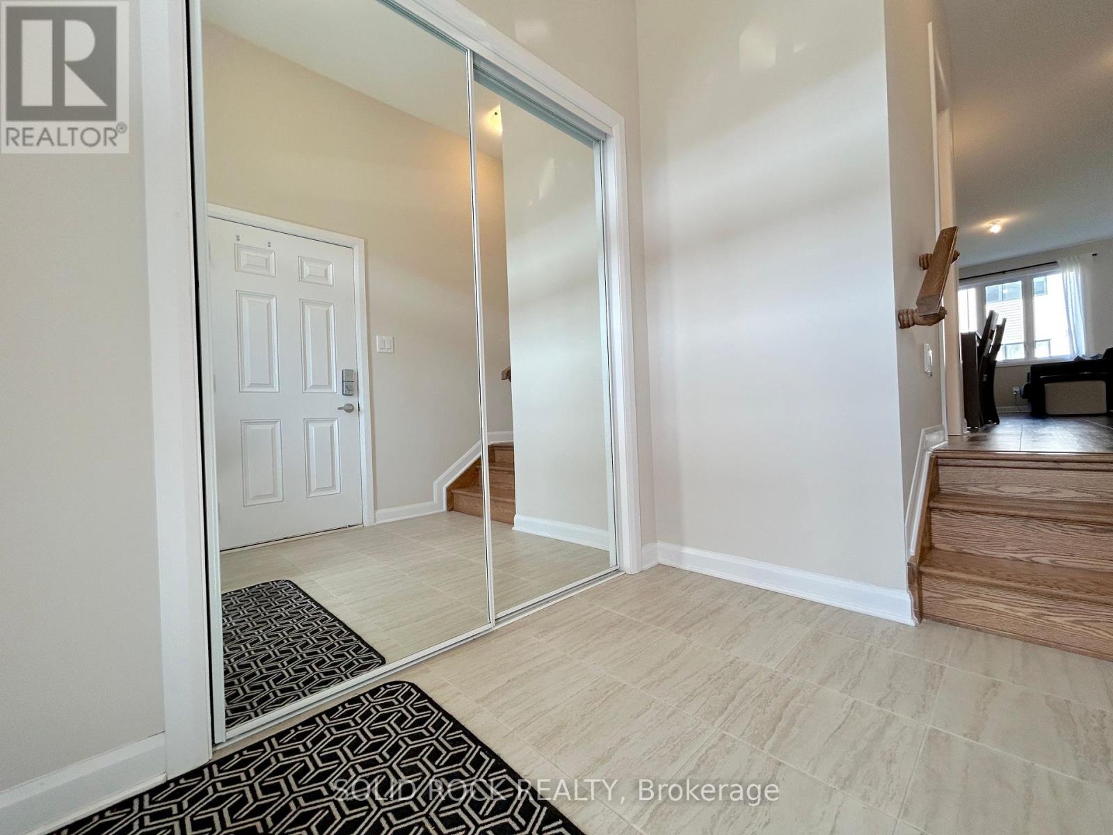 Mirrored door on entryway closet