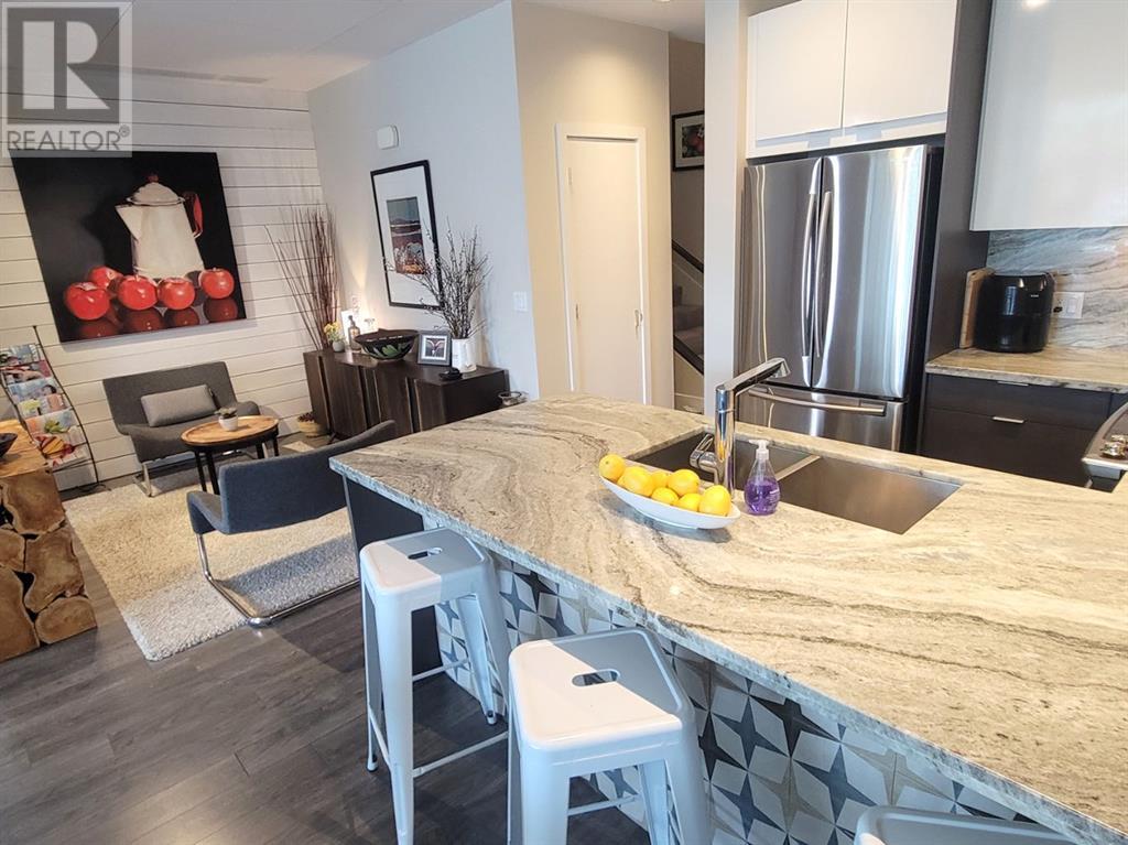 Single Family House for Sale in  Confluence Mews SE Downtown East Village Calgary 