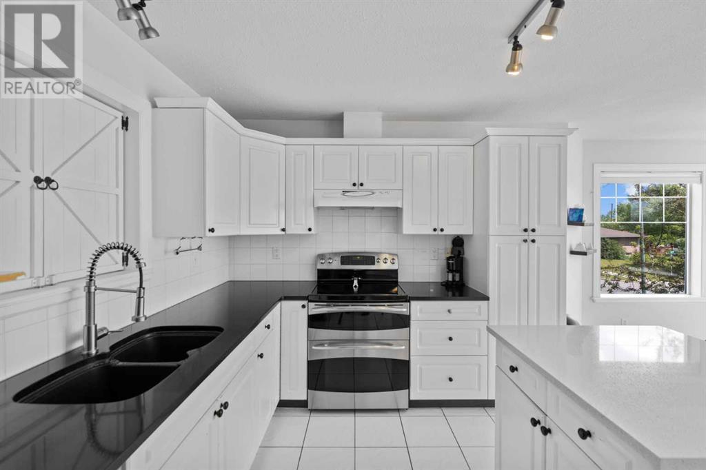 Single Family House 4 Level for Sale in  Northmount Drive NW Highwood Calgary 