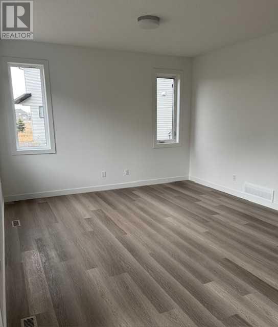 Photo 10 of 648 South Point Heath Sw, Airdrie AB