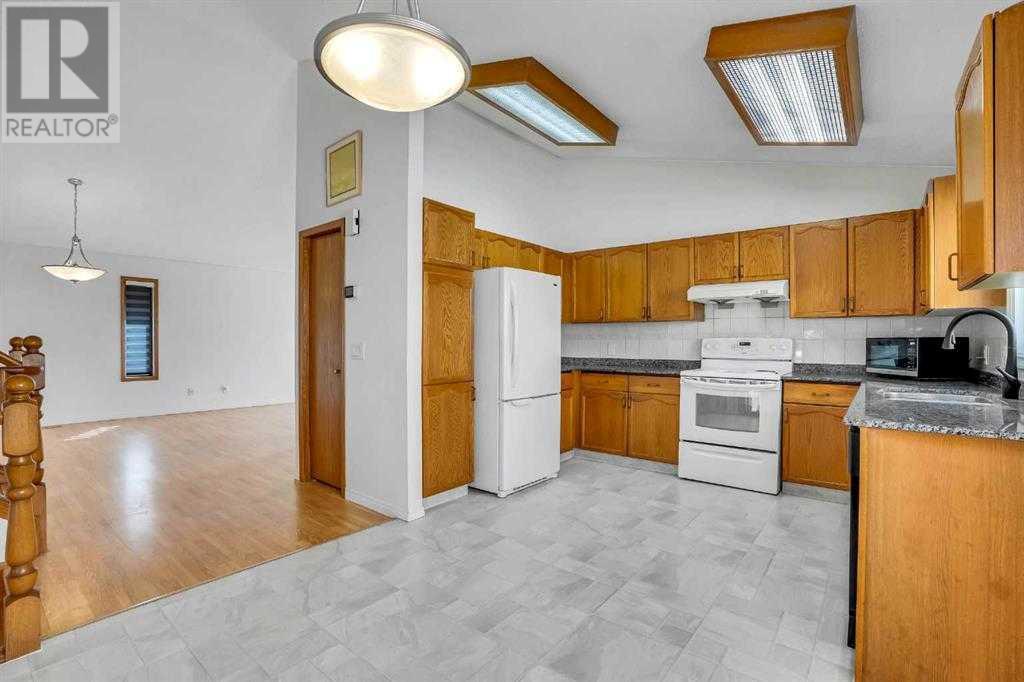 Single Family House 4 Level for Sale in  Del Monica Place NE Monterey Park Calgary 