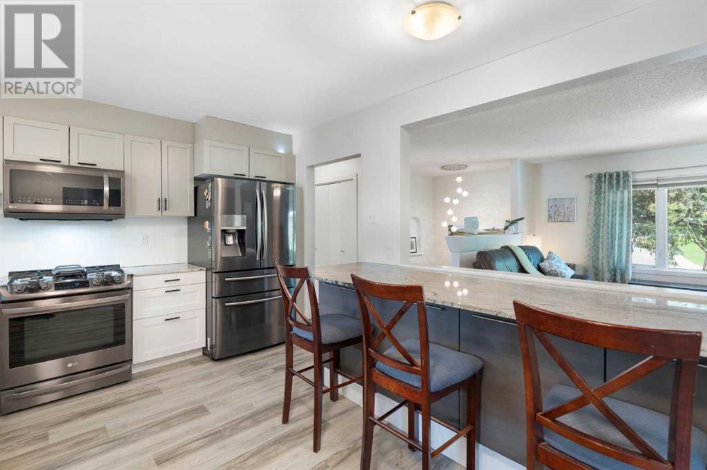 Single Family House Bi-level for Sale in  Bearspaw Drive NW Brentwood Calgary 