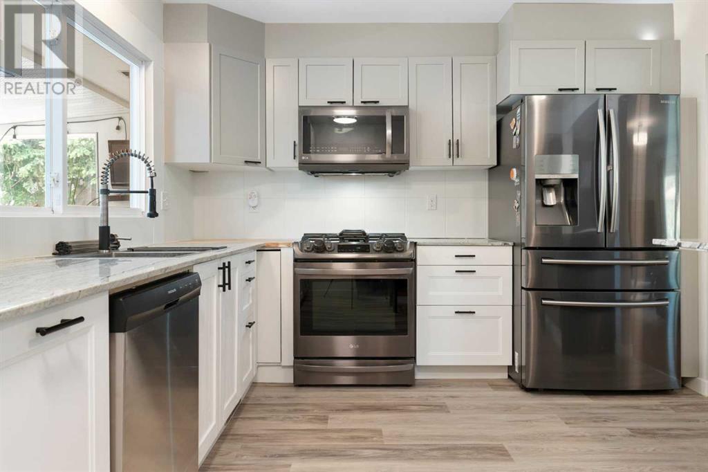 Single Family House Bi-level for Sale in  Bearspaw Drive NW Brentwood Calgary 
