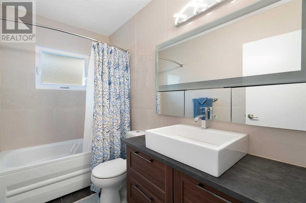 Single Family House Bi-level for Sale in  Bearspaw Drive NW Brentwood Calgary 