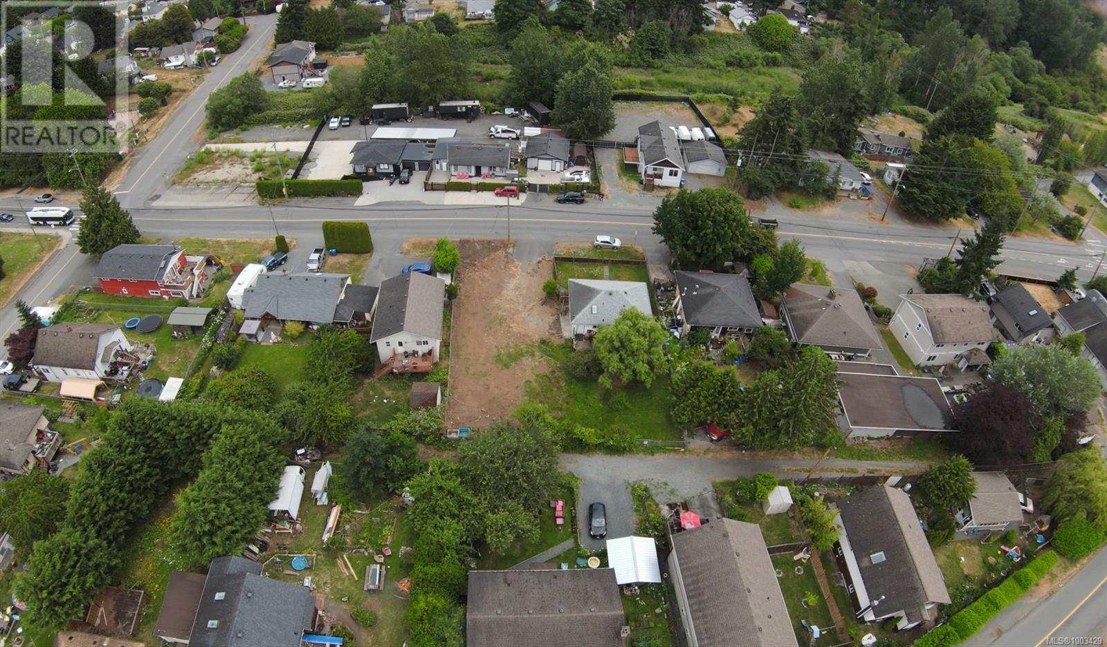 Aerial overview of property's location with nearby suburban area