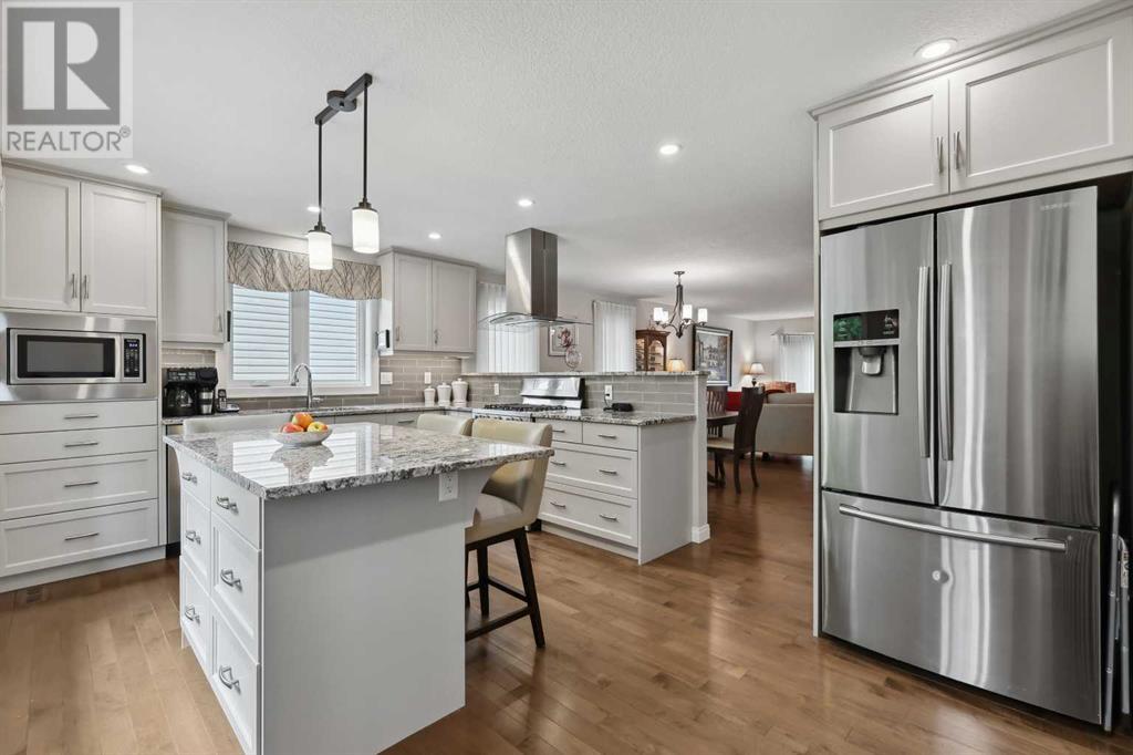Single Family House 4 Level for Sale in  Hawkcliff Way NW Hawkwood Calgary 
